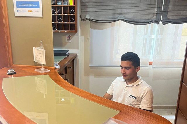 Juan Pablo is behind the reception desk at Casa Román.