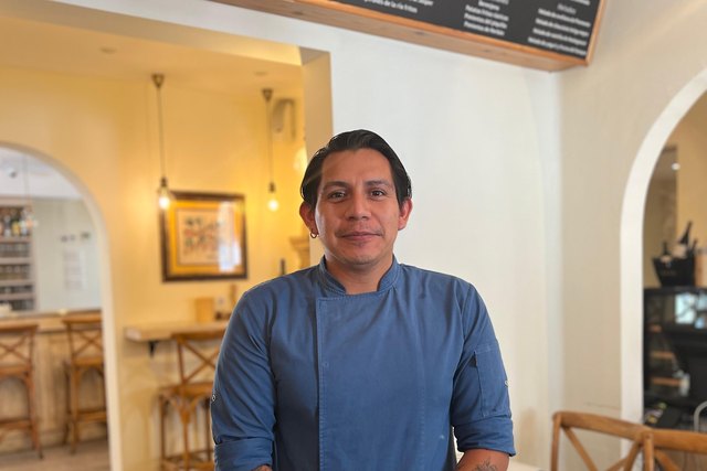 Ricardo Ontiveros poses in uniform in the Casa Román dining room.